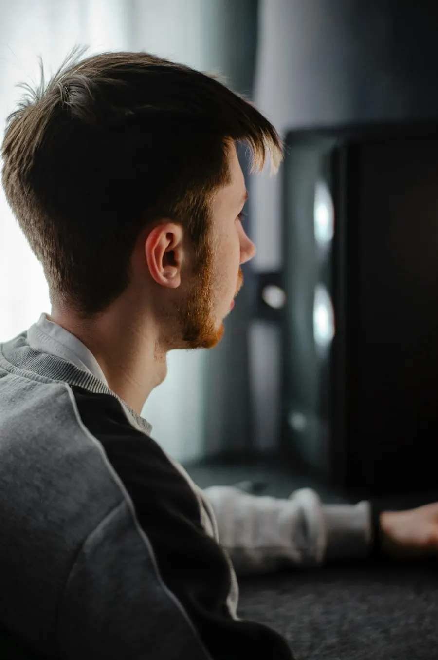 A man working at a computer monitor